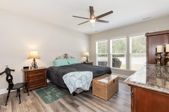 2501 Impulsion Dr, New Hill, NC 27562 - bedroom with light wood-type flooring, baseboards, and ceiling fan