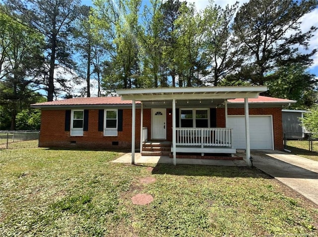 711 Reggie Ct, Spring Lake, NC 28390 - ranch-style house with crawl space, an attached garage, covered porch, driveway, and brick siding