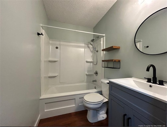 711 Reggie Ct, Spring Lake, NC 28390 - full bathroom with wood finished floors, a textured ceiling, toilet, vanity, and shower / bathtub combination