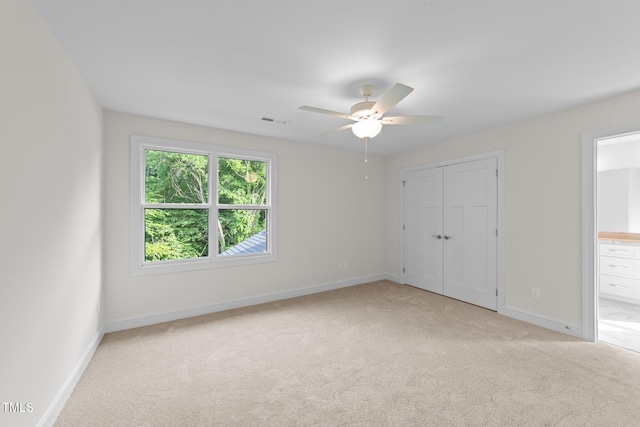 525 Allesandra Dr, Clayton, NC 27527 - unfurnished bedroom featuring light carpet, baseboards, a closet, connected bathroom, and a ceiling fan