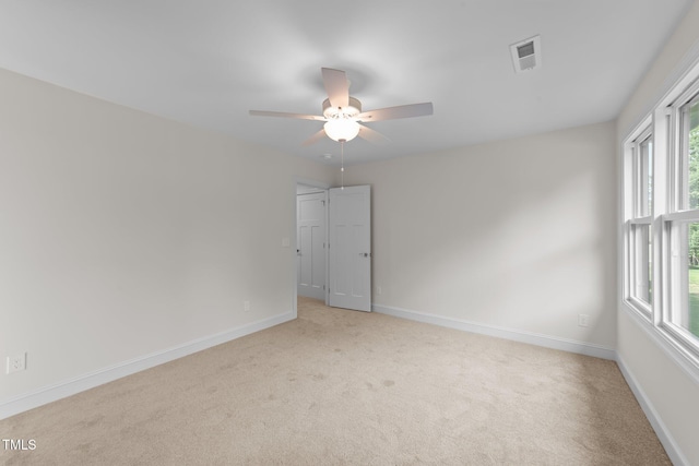 525 Allesandra Dr, Clayton, NC 27527 - spare room with light carpet, plenty of natural light, and ceiling fan