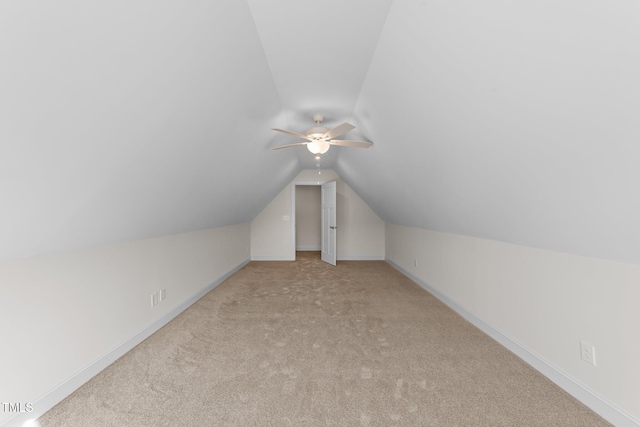 525 Allesandra Dr, Clayton, NC 27527 - additional living space featuring vaulted ceiling, light colored carpet, a ceiling fan, and baseboards