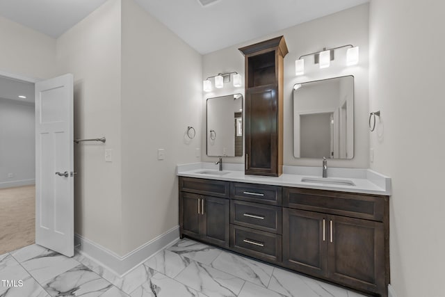 525 Allesandra Dr, Clayton, NC 27527 - bathroom featuring marble finish flooring, baseboards, and double vanity