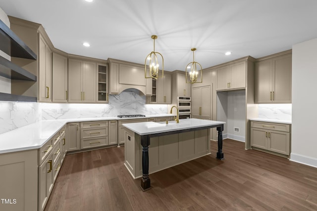 525 Allesandra Dr, Clayton, NC 27527 - kitchen with stainless steel appliances, recessed lighting, decorative backsplash, an island with sink, and dark wood-style floors