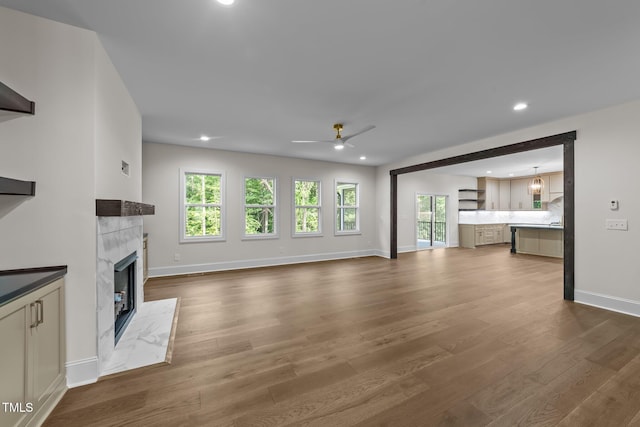 525 Allesandra Dr, Clayton, NC 27527 - unfurnished living room featuring a fireplace, baseboards, ceiling fan, dark wood-style floors, and recessed lighting