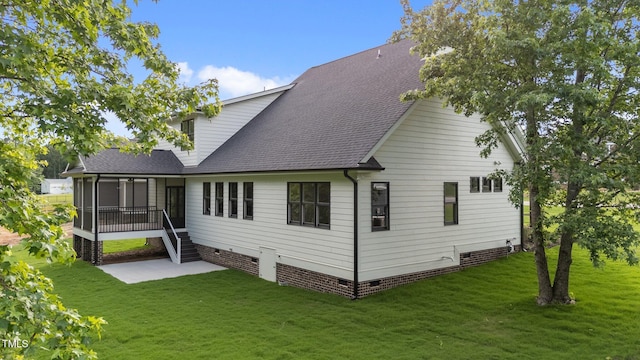 525 Allesandra Dr, Clayton, NC 27527 - back of property with crawl space, a sunroom, roof with shingles, and a yard