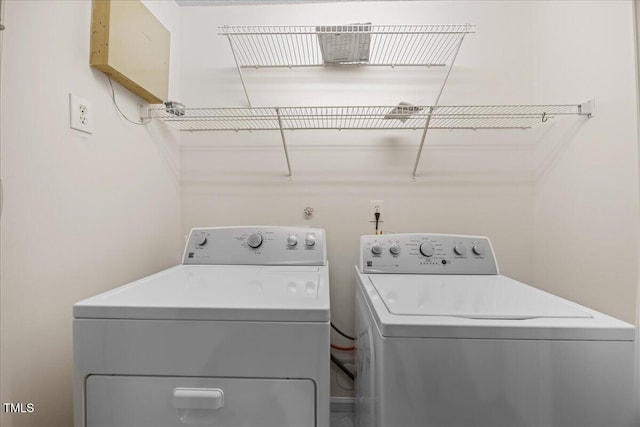 laundry room featuring washing machine and dryer