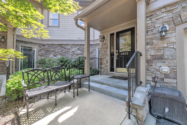 4802 Glenmist Ct, Raleigh, NC 27612 - property entrance featuring stone siding