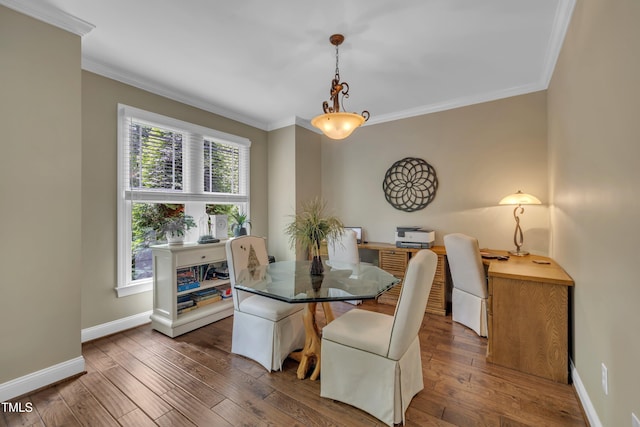4802 Glenmist Ct, Raleigh, NC 27612 - dining area featuring crown molding, plenty of natural light, baseboards, wood-type flooring, and an office area