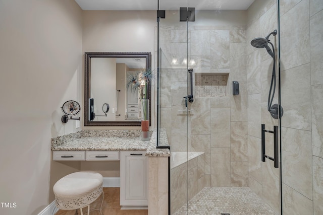 4802 Glenmist Ct, Raleigh, NC 27612 - bathroom featuring a stall shower, vanity, and tile patterned floors