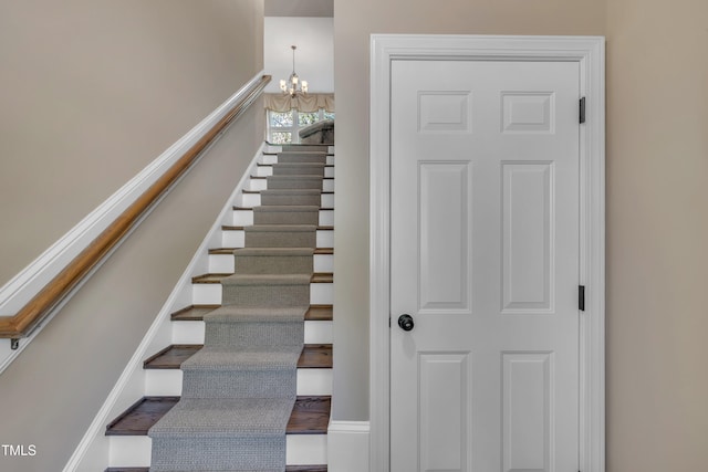 4802 Glenmist Ct, Raleigh, NC 27612 - stairway featuring a chandelier