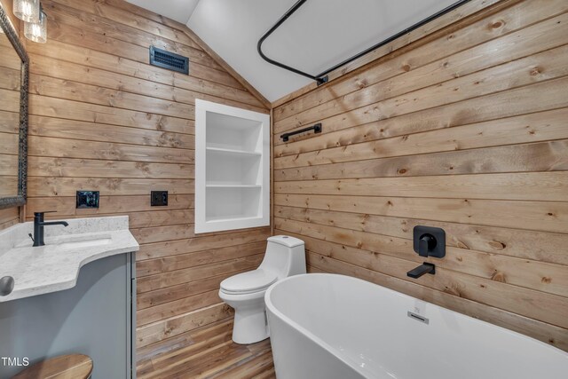 4802 Glenmist Ct, Raleigh, NC 27612 - bathroom featuring wooden walls, a soaking tub, lofted ceiling, wood finished floors, and toilet