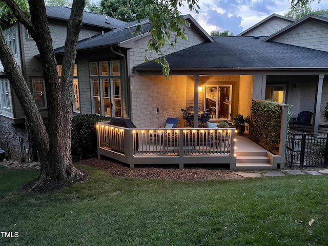 4802 Glenmist Ct, Raleigh, NC 27612 - back of house with a shingled roof, a lawn, and a deck