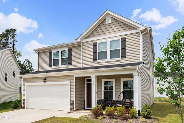 209 White Farm Dr, Wendell, NC 27591 - view of front of home with a porch, driveway, a garage, stone siding, and a front lawn