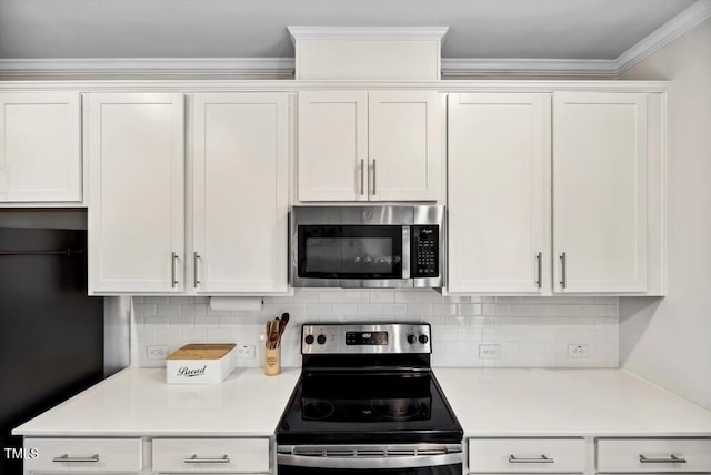 209 White Farm Dr, Wendell, NC 27591 - kitchen with appliances with stainless steel finishes, light countertops, white cabinetry, decorative backsplash, and ornamental molding