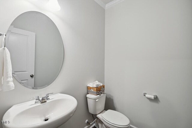 209 White Farm Dr, Wendell, NC 27591 - bathroom with a sink, ornamental molding, toilet, and baseboards