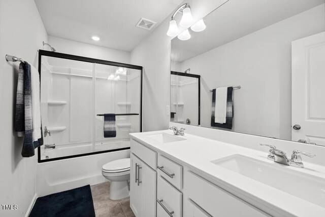 209 White Farm Dr, Wendell, NC 27591 - full bath featuring toilet, double vanity, bath / shower combo with glass door, tile patterned flooring, and recessed lighting