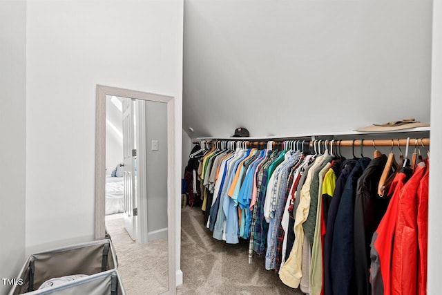 walk in closet featuring carpet