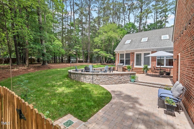 view of green lawn with a patio area and entry steps
