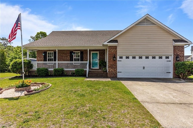 view of front of home with driveway, an attached garage, covered porch, a front yard, and brick siding