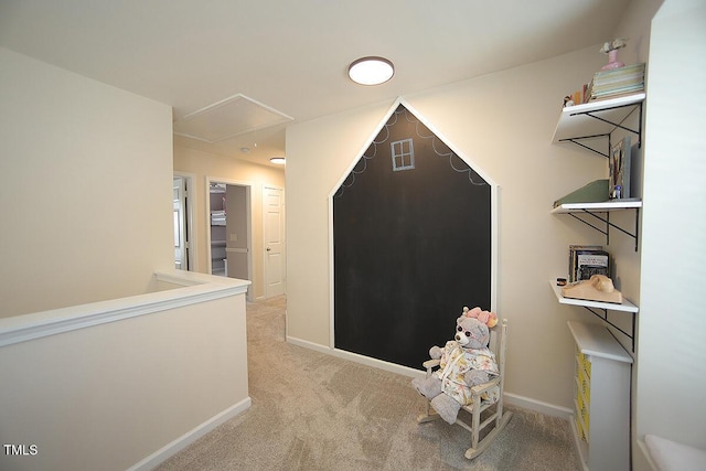 bonus room with attic access, light carpet, and baseboards
