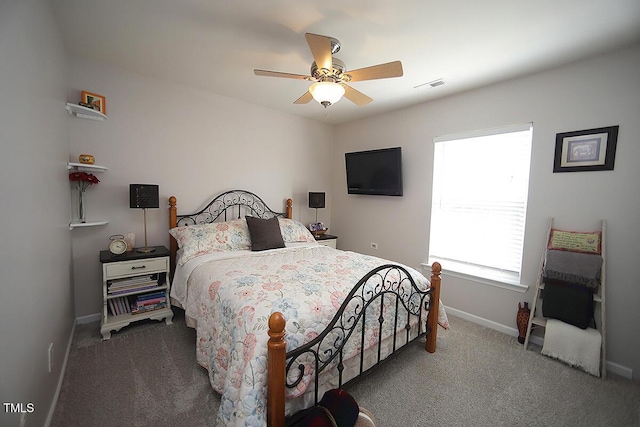 bedroom with carpet, baseboards, and a ceiling fan