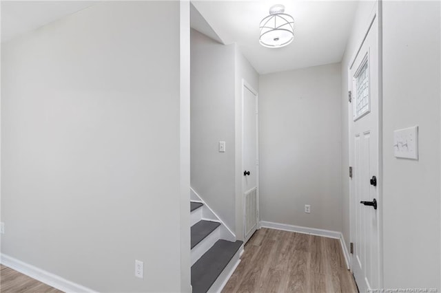 70 Oregon Ln, Spring Lake, NC 28390 - corridor featuring wood finished floors, baseboards, and stairway