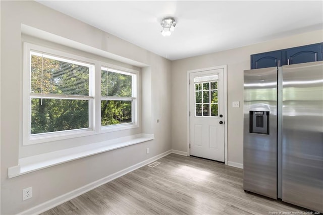 70 Oregon Ln, Spring Lake, NC 28390 - doorway to outside featuring baseboards and light wood-style flooring