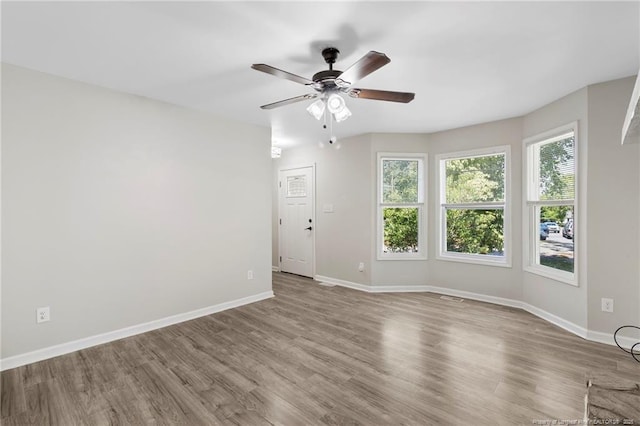 70 Oregon Ln, Spring Lake, NC 28390 - unfurnished room featuring ceiling fan, baseboards, and wood finished floors