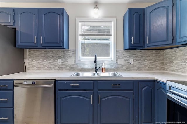 70 Oregon Ln, Spring Lake, NC 28390 - kitchen featuring dishwasher, blue cabinetry, a sink, and light countertops