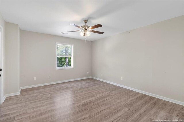 70 Oregon Ln, Spring Lake, NC 28390 - spare room featuring ceiling fan, light wood-type flooring, and baseboards