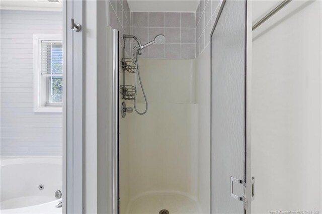70 Oregon Ln, Spring Lake, NC 28390 - bathroom with a stall shower and a tub with jets
