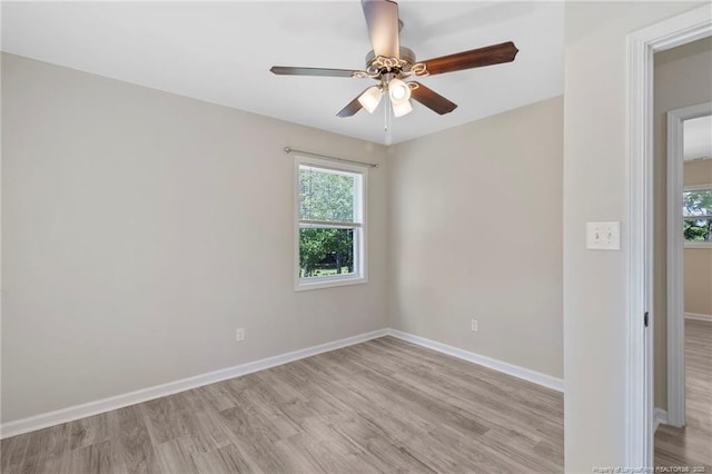 70 Oregon Ln, Spring Lake, NC 28390 - empty room featuring healthy amount of natural light, light wood-style floors, and a ceiling fan