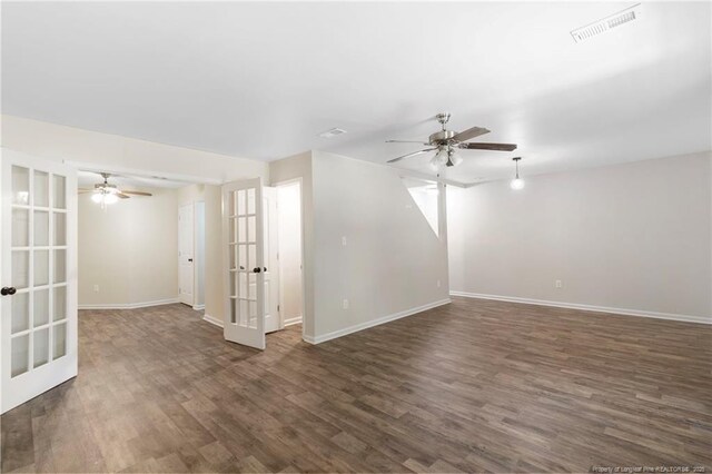 70 Oregon Ln, Spring Lake, NC 28390 - spare room featuring a ceiling fan, french doors, baseboards, and dark wood-type flooring