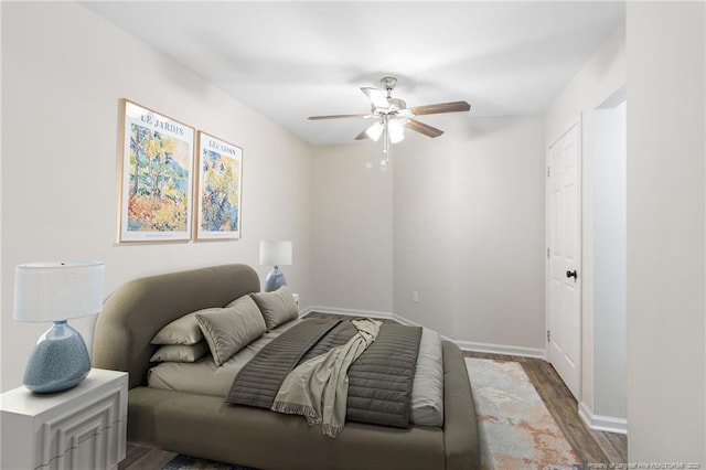 70 Oregon Ln, Spring Lake, NC 28390 - bedroom featuring wood finished floors, baseboards, and a ceiling fan