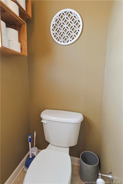 3603 Talus Rd, Fayetteville, NC 28306 - bathroom featuring toilet, baseboards, and tile patterned flooring