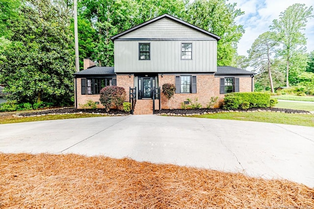 225 Lakeview Dr, Sanford, NC 27332 - view of front of house with brick siding and a chimney