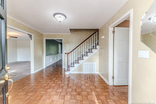 225 Lakeview Dr, Sanford, NC 27332 - entrance foyer with stairway, baseboards, crown molding, and a ceiling fan