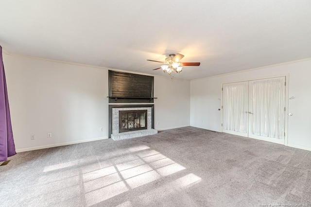 225 Lakeview Dr, Sanford, NC 27332 - unfurnished living room with a ceiling fan, carpet floors, a fireplace, ornamental molding, and baseboards