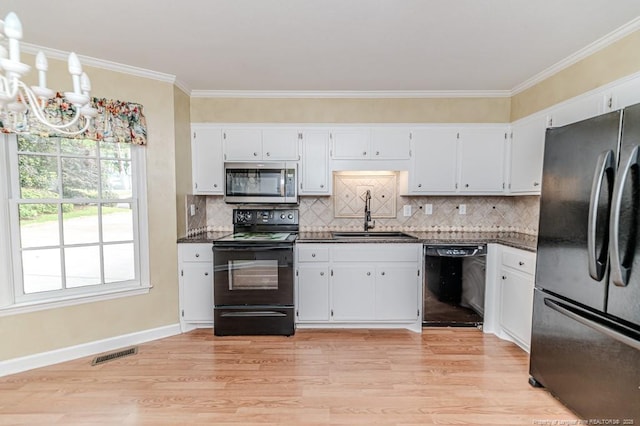 225 Lakeview Dr, Sanford, NC 27332 - kitchen with black appliances, a sink, dark countertops, light wood finished floors, and ornamental molding