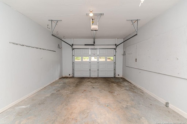 225 Lakeview Dr, Sanford, NC 27332 - garage with a garage door opener and baseboards