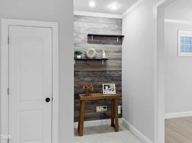 interior space with crown molding and baseboards