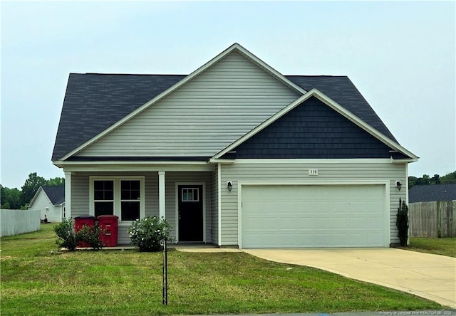 338 E David Parnell St, Parkton, NC 28371 - craftsman-style home featuring driveway, covered porch, and an attached garage