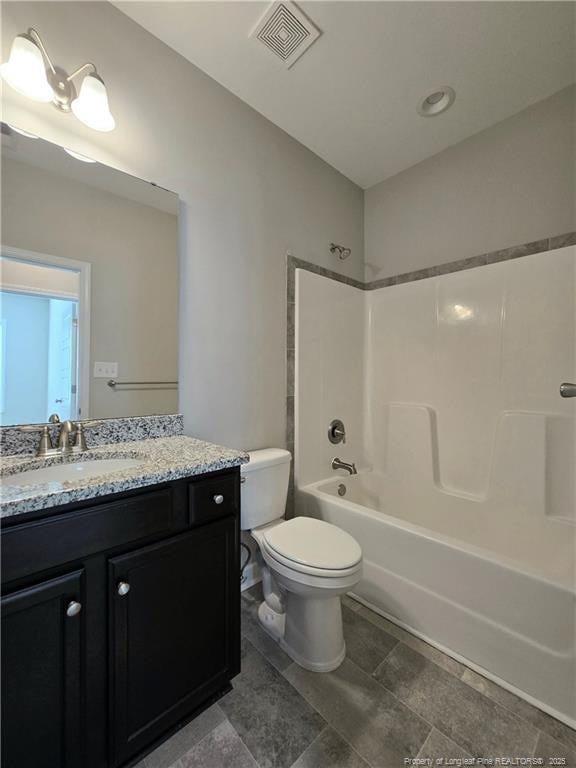 338 E David Parnell St, Parkton, NC 28371 - full bathroom with toilet, vanity, and shower / bath combination