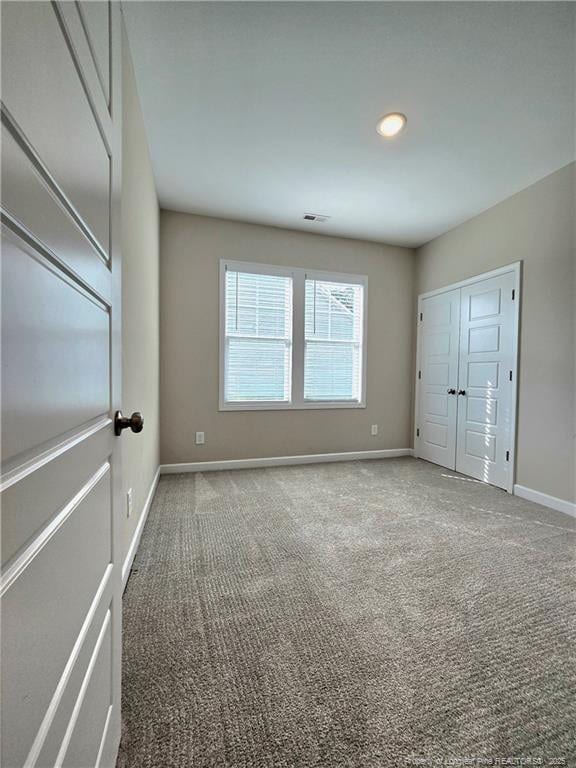 338 E David Parnell St, Parkton, NC 28371 - unfurnished bedroom featuring carpet flooring, baseboards, recessed lighting, and a closet