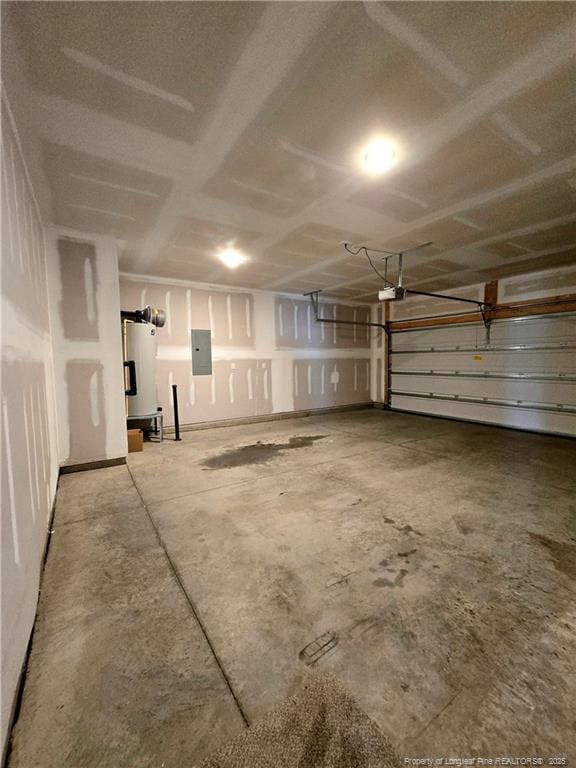 338 E David Parnell St, Parkton, NC 28371 - garage with electric panel, water heater, and a garage door opener
