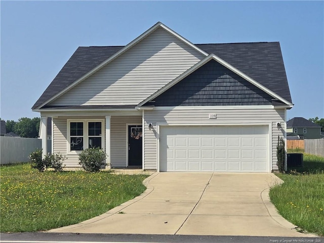 338 E David Parnell St, Parkton, NC 28371 - view of front of property with an attached garage, driveway, and roof with shingles
