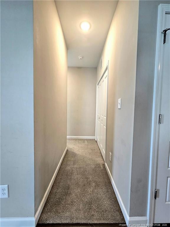 338 E David Parnell St, Parkton, NC 28371 - corridor featuring carpet flooring and baseboards