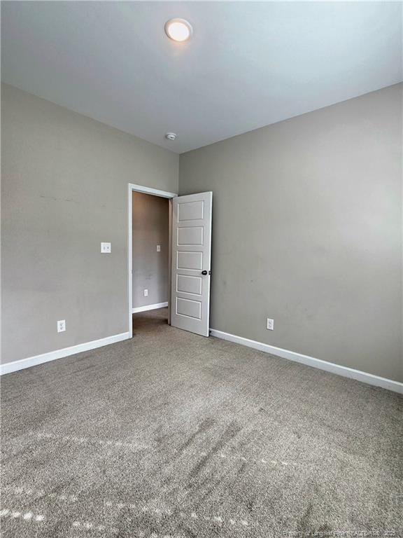 338 E David Parnell St, Parkton, NC 28371 - empty room with a smoke detector and carpet floors