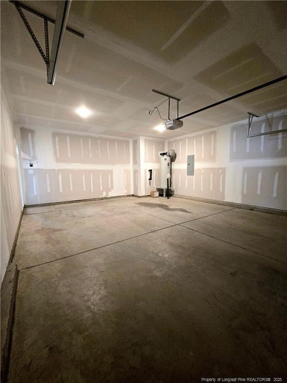 338 E David Parnell St, Parkton, NC 28371 - garage featuring electric panel, water heater, and a garage door opener